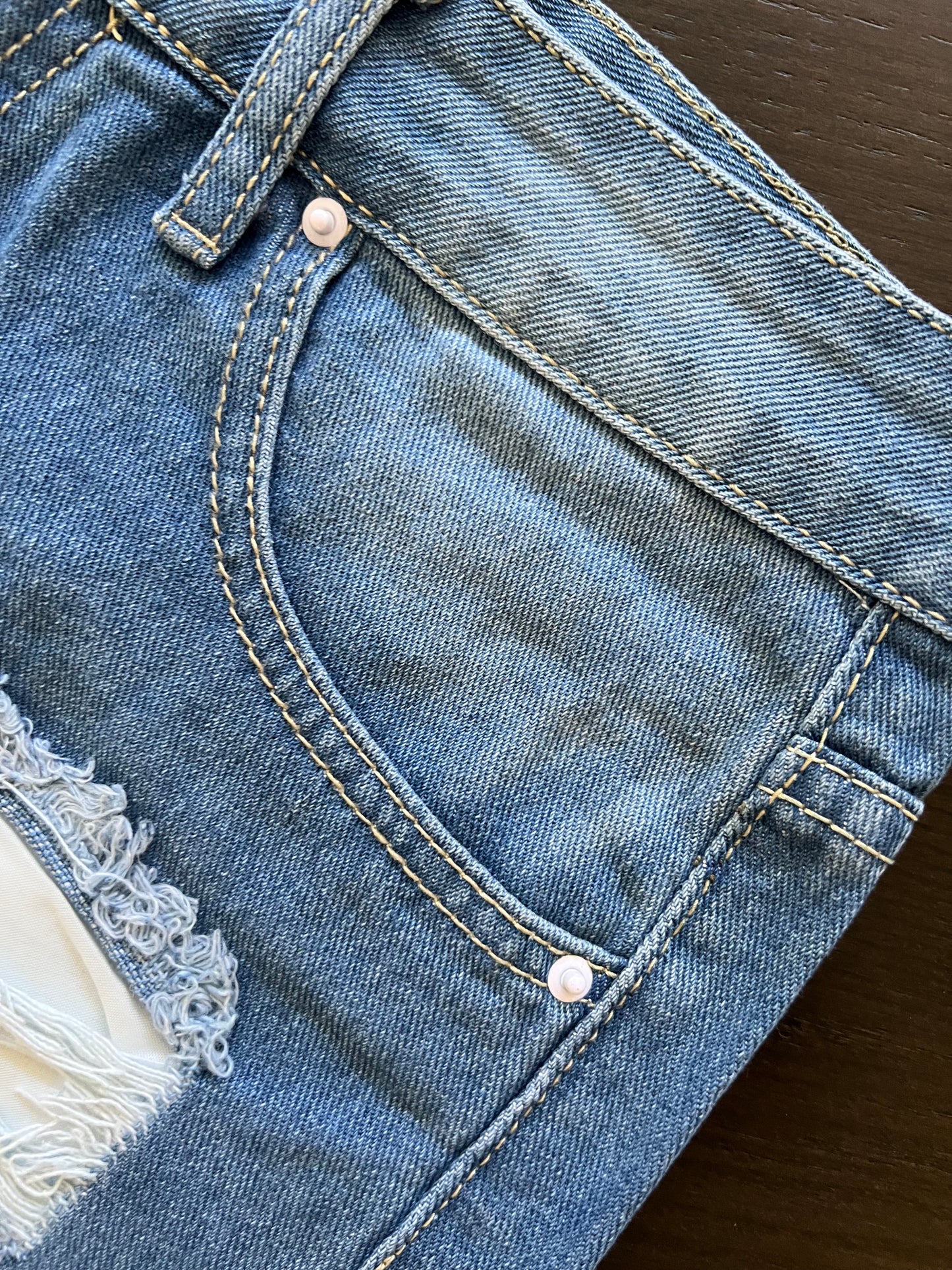 Mid Rise Frayed Raw Hem Ripped Blue Denim Shorts with 4-Button Fly